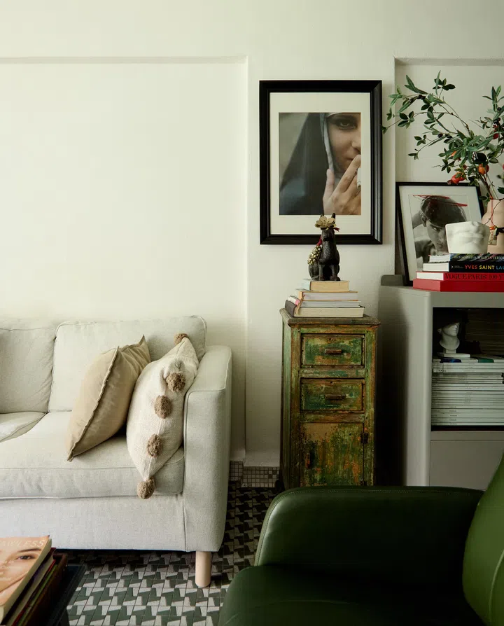 The well-worn cabinet beneath the portrait once belonged to the Singapore painter Jimmy Ong.