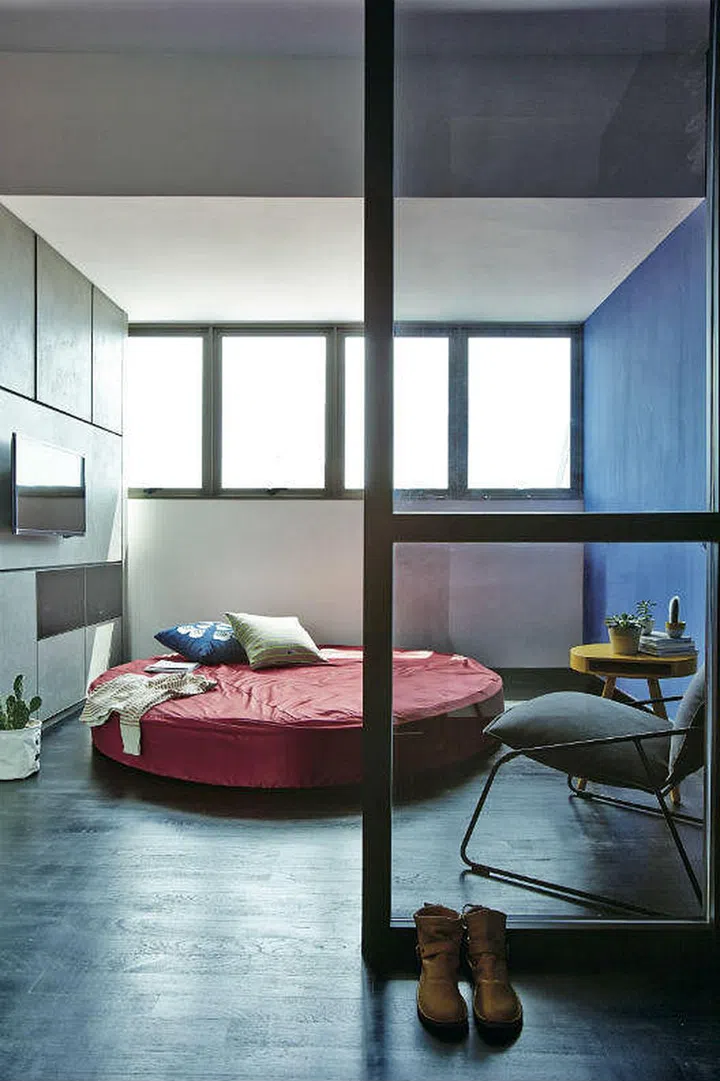 Glass walk-in closet. An edgy and minimalist two-storey one-bedroom condo unit