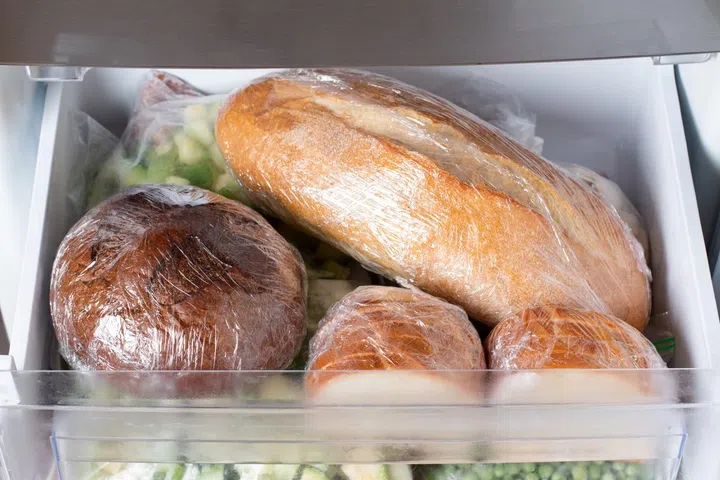 Frozen bread in the home freezer. Frozen bread: ciabatta, loaf, hamburger buns