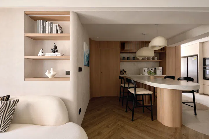 An open-plan layout connects the living room to the dining area, enhancing flow and functionality.