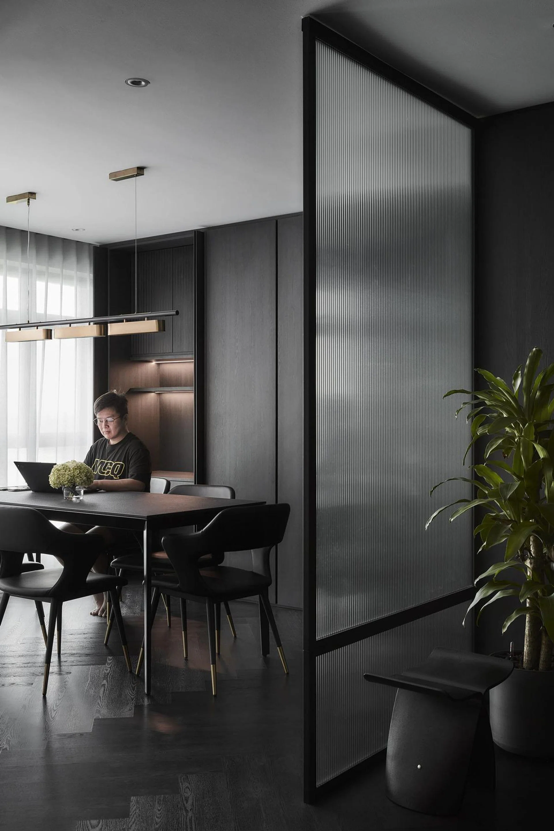Homeowner James Chua’s posing for a picture at his dining table in this 4-room Punggol HDB flat that has recently fulfilled its Minimum Occupation Period (MOP).