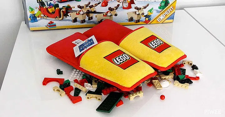 anti lego slippers placed in front of lego blocks