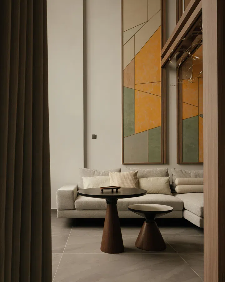 Abstracted from travel memories, the murals introduce colour and depth while anchoring the living space.