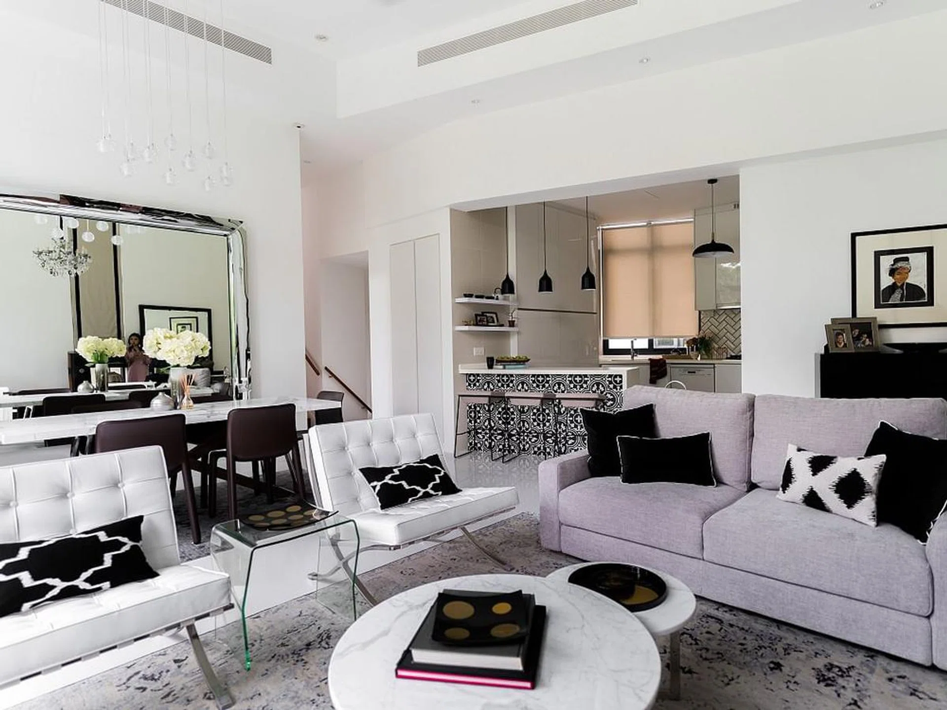 A chic black-and-white D’Leedon home living room with a $30,000 renovation price tag