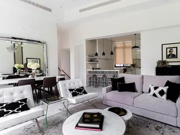A chic black-and-white D’Leedon home living room with a $30,000 renovation price tag