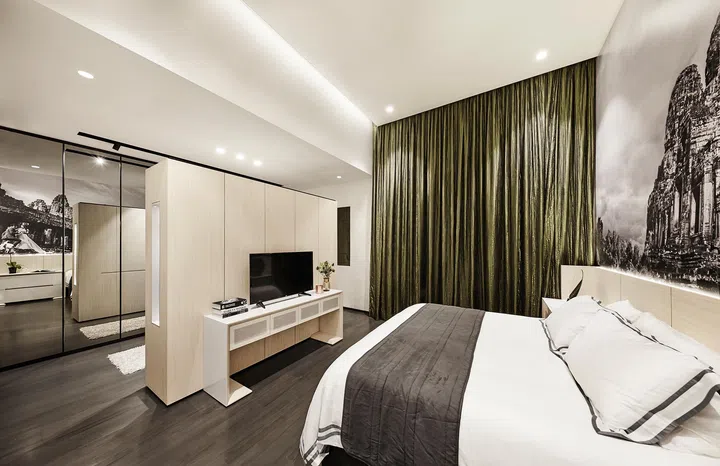 Master bedroom with a TV console after renovation in a 3-bedroom condo in East Coast.