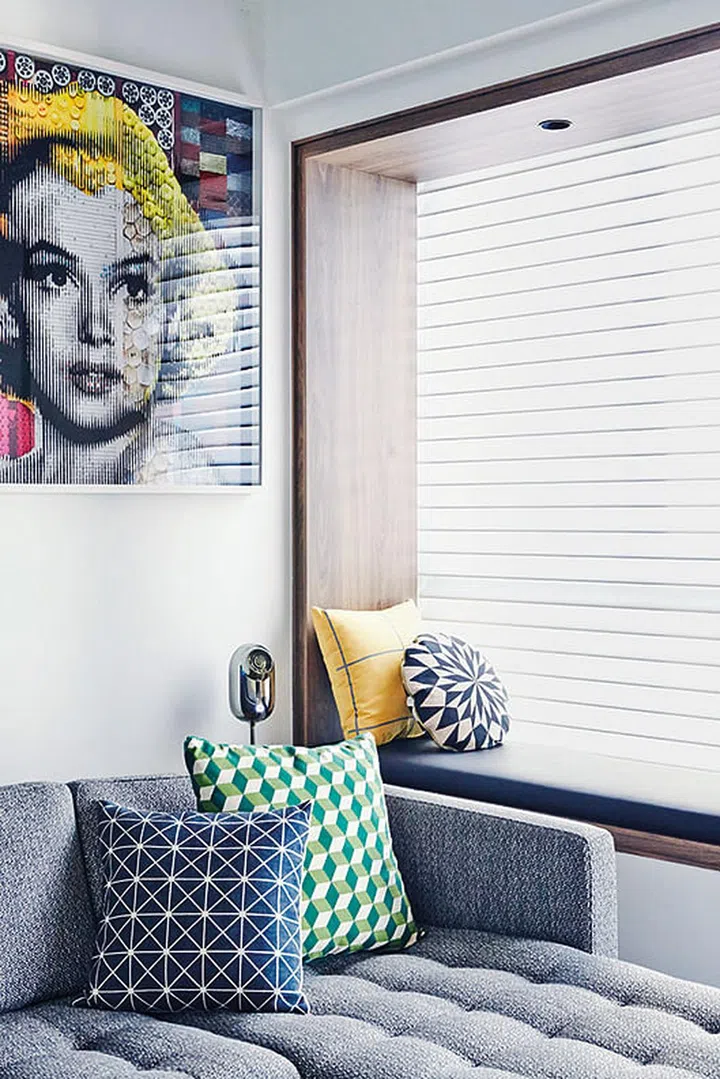 The once bare- looking bay window now has a wooden frame that makes it stand out.