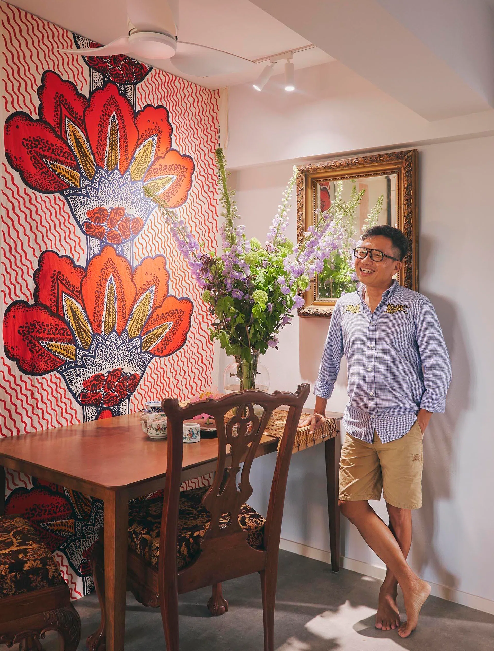 A vibrant Marimekko textile forms the backdrop to the dining area, reflecting Ivan’s willingness to mix bold contemporary pieces with traditional furnishings and collected antiques.