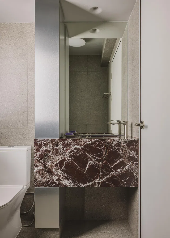 A shower, vanity, and toilet comprise the en suite setting.