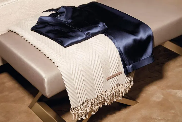 Armani Casa Exclusive Textiles by Rubelli collection include wool, hand-woven cashmere, silk, and even raw silk with raised weave