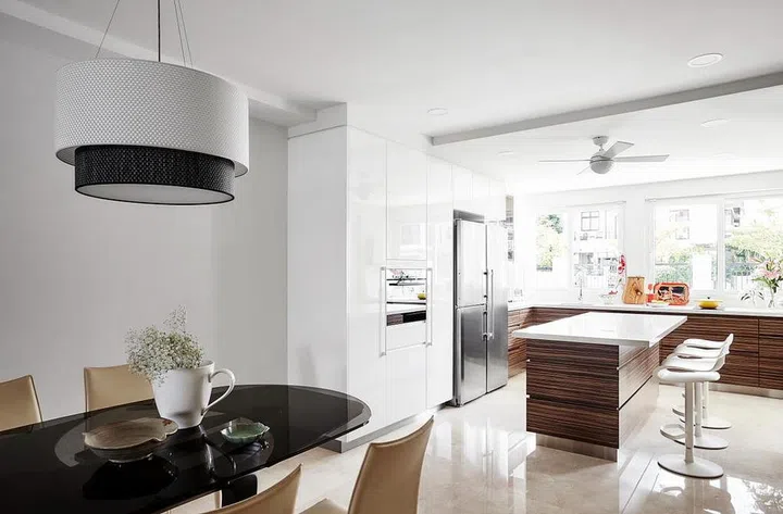 Dining room and kitchen in 3 Lor L Telok Kurau designed by Collective Designs.
