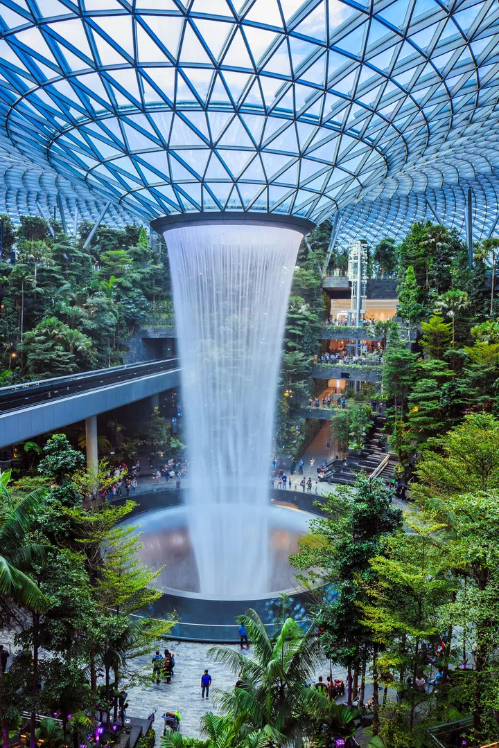 Singapore - July 24, 2019: The world’s tallest indoor waterfall, named the Rain Vortex, which is surrounded by a terraced forest setting at Jewel Changi Airport, Singapore.