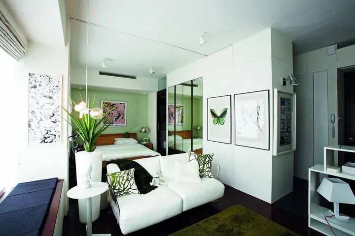 Left pretty much in the original state, the home was dressed up with chic furnishings like Pop Art prints and funky lighting from Moooi. 