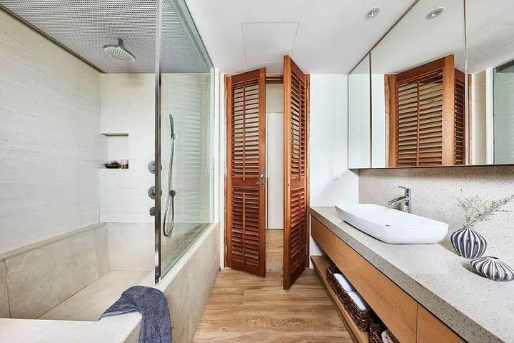 The homeowners of this condominium apartment wanted the master bathroom to have both a shower area and bathtub. Interior design by Piu Design