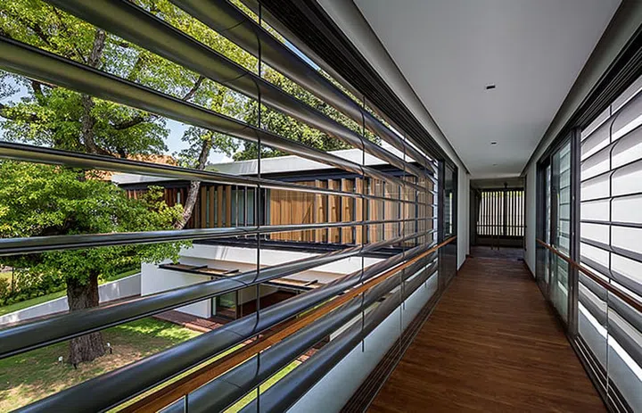 Hardwood sunscreen fins are a reinterpretation of the tropical louvred windows of old colonial bungalows, letting light into the second storey corridors, whilst retaining the privacy of the interior.  