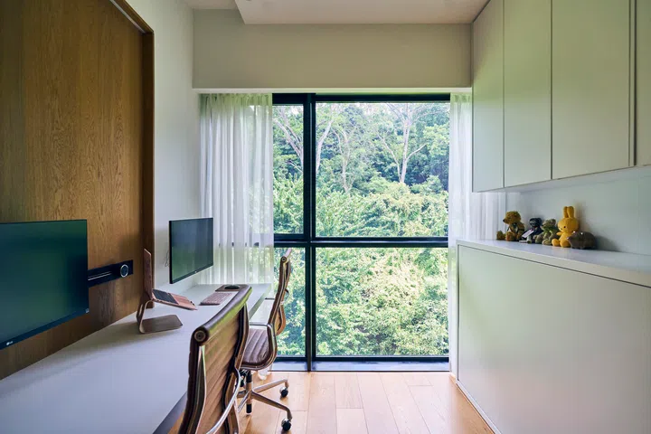 Timber cladding runs throughout the house in a continuous language.