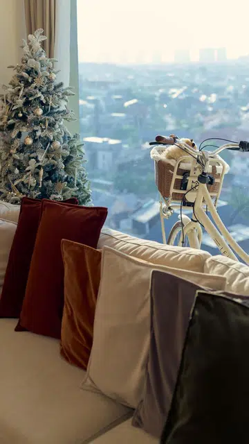 Coloured cushions in various shades that align with the theme decked the sectional sofa. According to Ryan, he waited three months for these coveted Journey East cushions to arrive. 