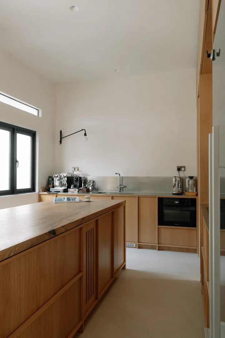 The oversized oak island was designed primarily as a generous workspace for Lina’s sourdough baking, a passion she picked up in Copenhagen.