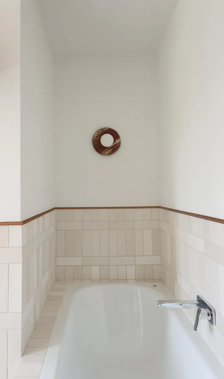 A freestanding tub offers a calming retreat, perfect for winding down at the end of the day.