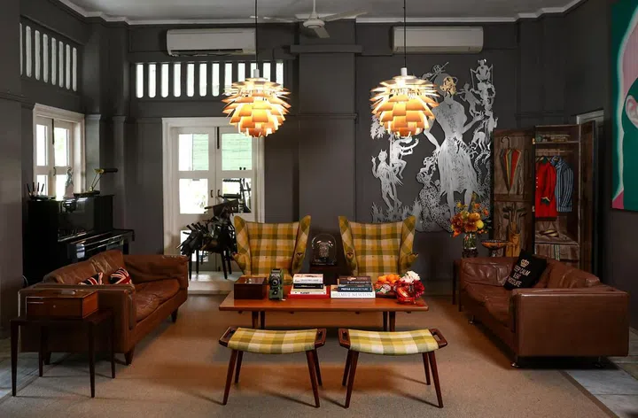 Here, 1B2G Fine Vintage Furniture store owner Lynette's living room space is filled with designer furniture icons including 1960’s Artichoke lights by Poul Henningsen Papa bear armchairs by Hans Wegner and sofas by Illum Wikkelso
