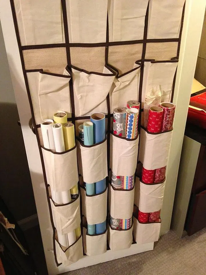 Store rolls of wrapping paper in a hanging shoe organiser.