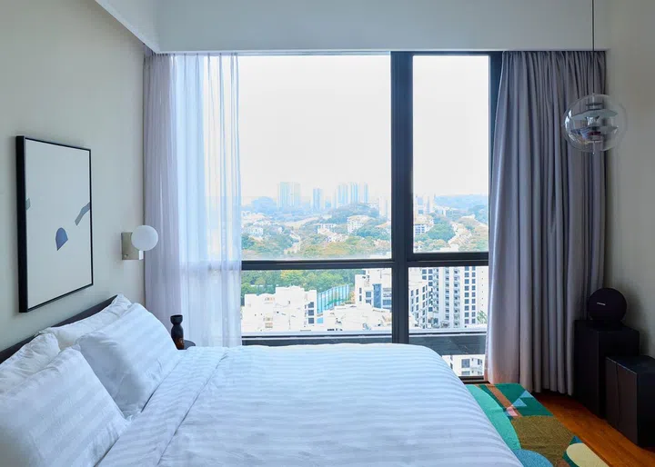 Master bedroom with a breathtaking view of the Hillview vicinity in this 840 sq ft 2-bedroom condominium at Hillview Rise.