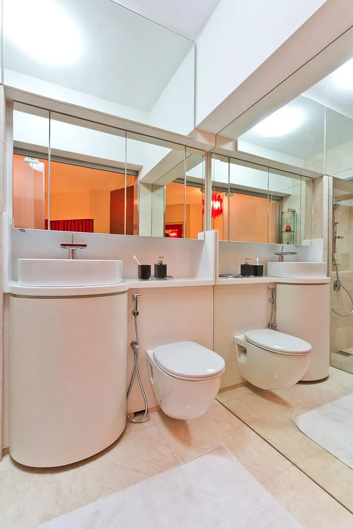 This might look like an ordinary bathroom, but if you're faced with a really small bathroom, full-length mirrors make a world of a difference.