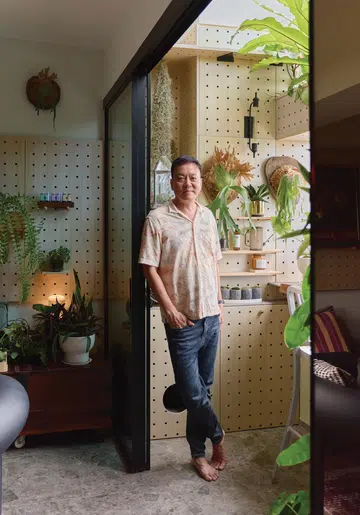 Architect and interior designer Winston Lim (of Winstudio) poses for a photograph in his 3-room HDB in Pasir Ris.