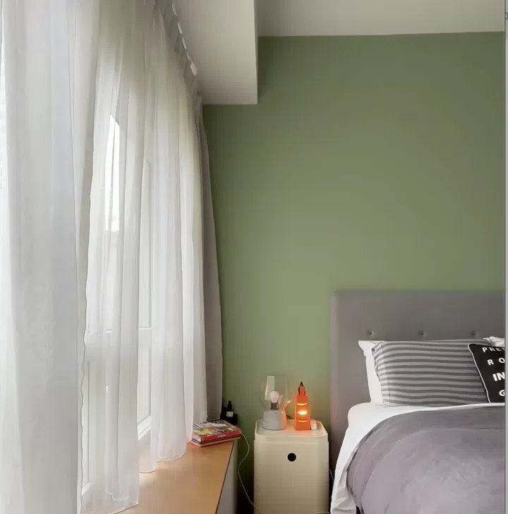 Soft, warm lighting sets the tone at night, reinforcing the bedroom’s calm and restful atmosphere.