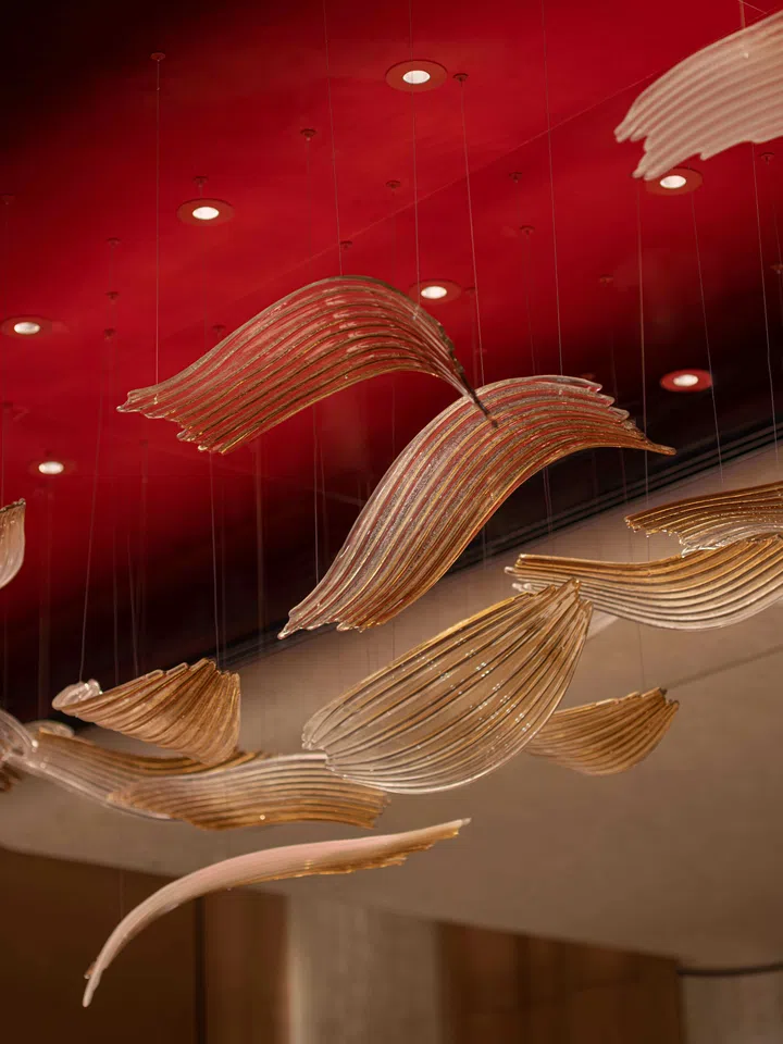 A custom Sans Souci crystal chandelier designed to mirror sunlight filtering through a bamboo grove.