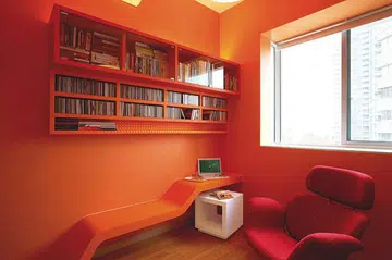 Bright orange study room in this 3-bderoom condominium designed by interior designer Raymond Seow from Free Space Intent.