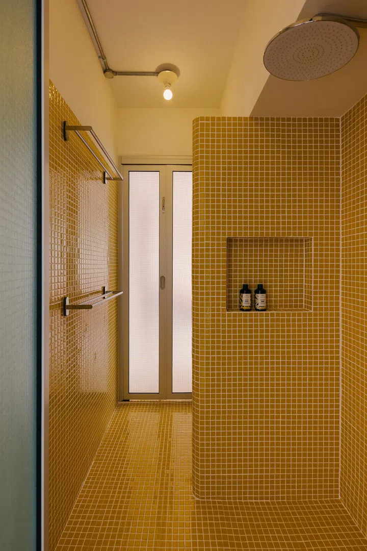 The Master Bathroom is playful yet serene with a separate shower and bath area. Image by Marcus @marcus.ip.