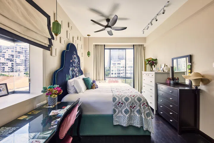A scallop-shaped headboard in the master bedroom, designed with Louve Luxe.