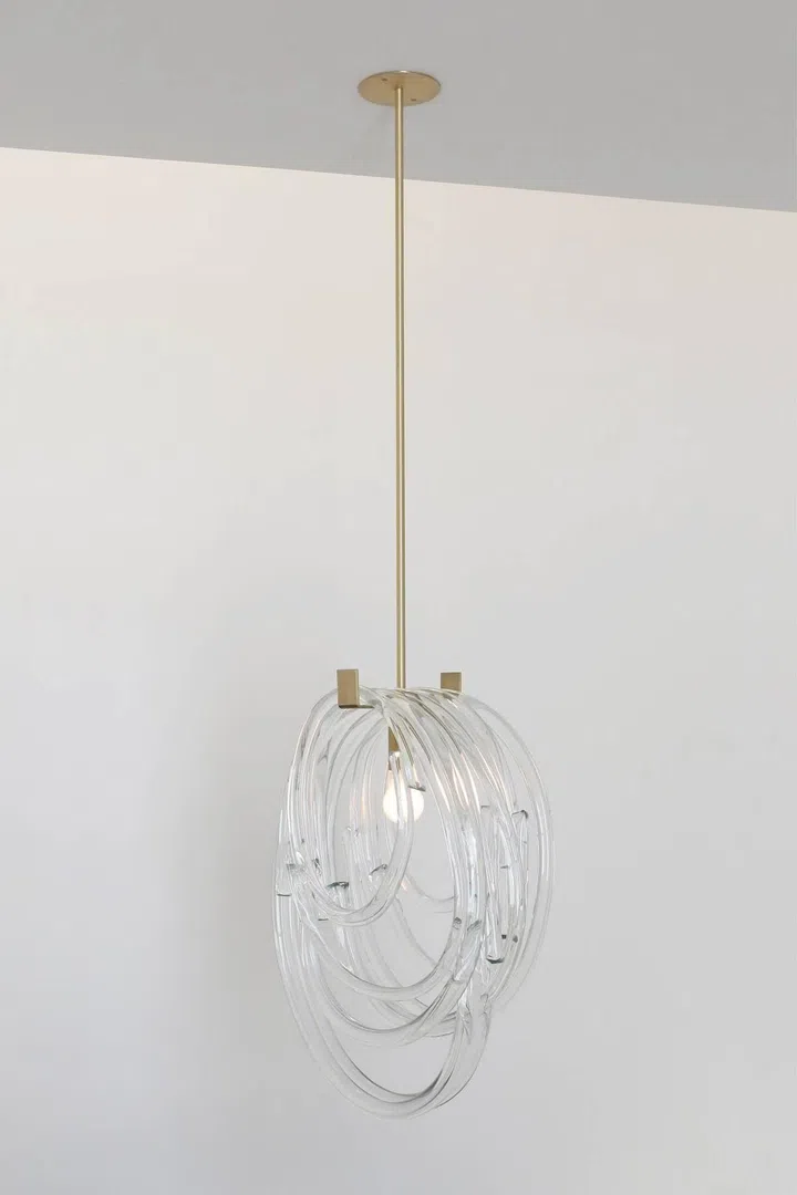 SkLO Lasso pendant lamp in clear glass, brushed brass, and gold cord is priced at $7,299 from Sol Luminaire Singapore