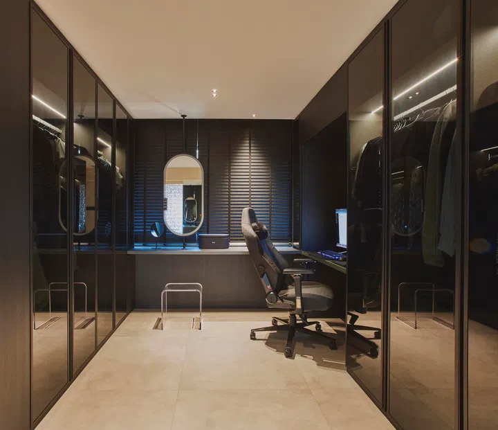 Two side-by-side recessed ceiling lights provide moody lighting. There is a window in this room, too, allowing natural light in. 
