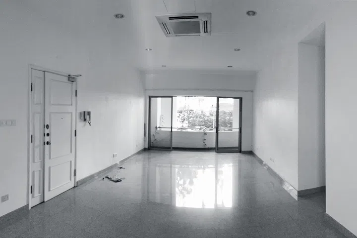 The living room before renovation in a 3-bedroom condominium in East Coast.