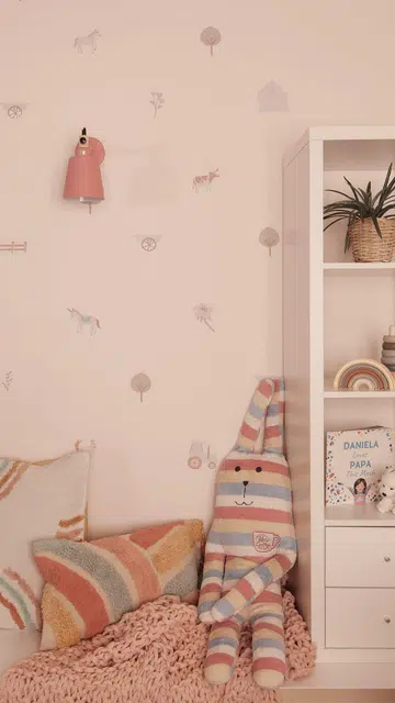 Cute wallpaper line the children's bedroom in this Parisian-style interior design Clydeswood condominium in Potong Pasir.