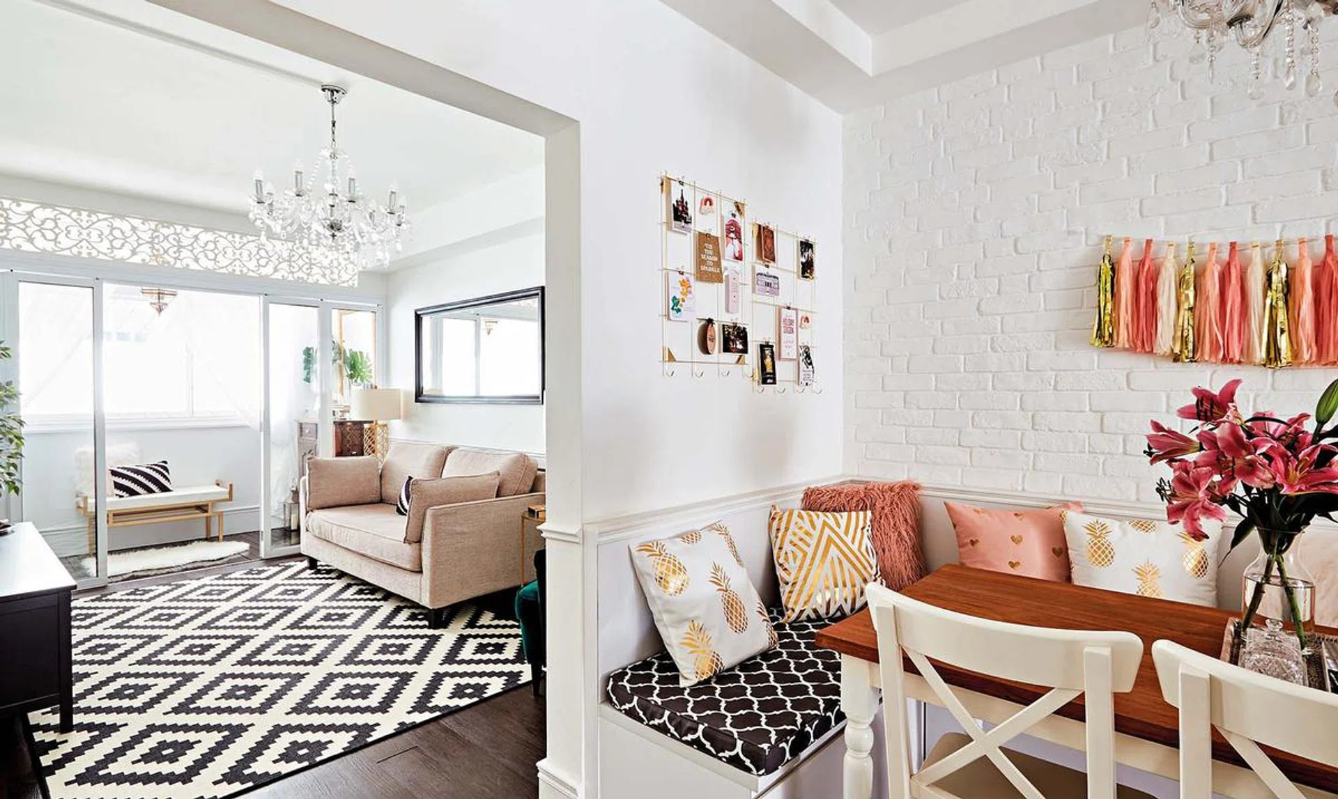 Black and white blend harmoniously with gold, rose gold and pink accents to create a fresh and romantic vibe. This dining area was formerly a store room.