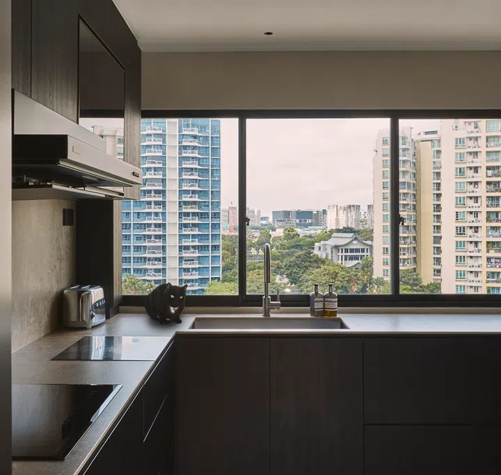 The kitchen boasts cool tones and textures. 