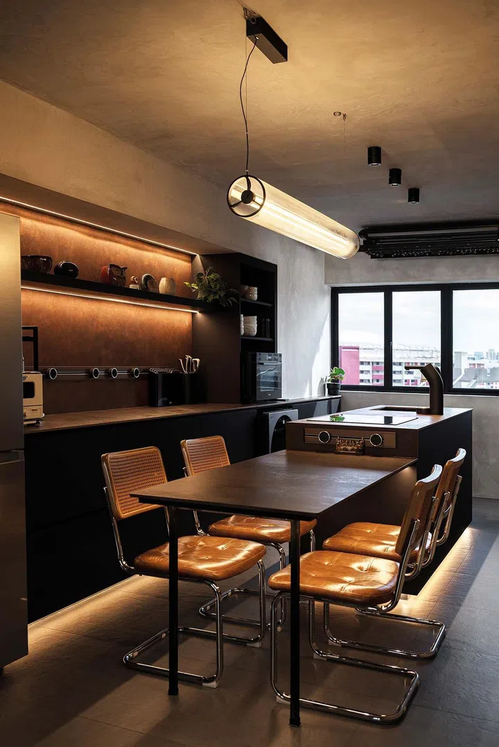 Kitchen island and dining table in a 3-room HDB flat in Ang Mo Kio.