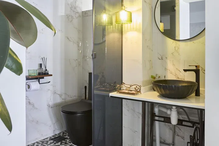 Colonial-style powder room on the first floor of this HDB Executive Maisonette along Woodlands Drive for a family of 5.