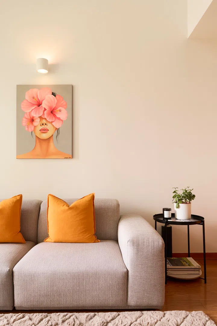 Orange accents, Terence’s signature colour, appear in cushions and artwork, adding warmth to the neutral palette.