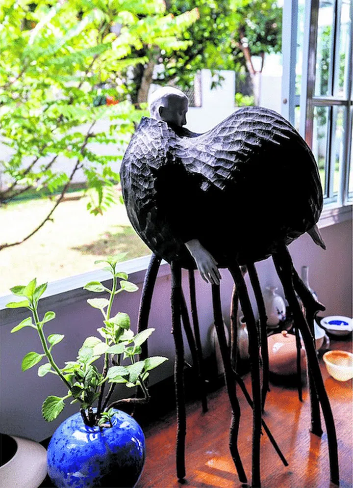 Gallery owner, Mr Kenneth Tan's art collection, some pieces which are placed on the floor of his semi-detached house in Yio Chu Kang, do not interest the dogs.