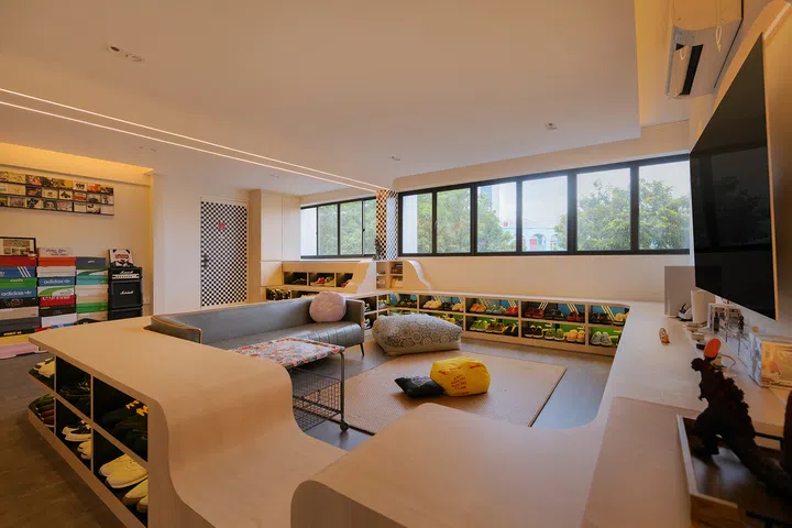 The conversation pit’s eclectic seating reflects the family’s playful, informal personality.