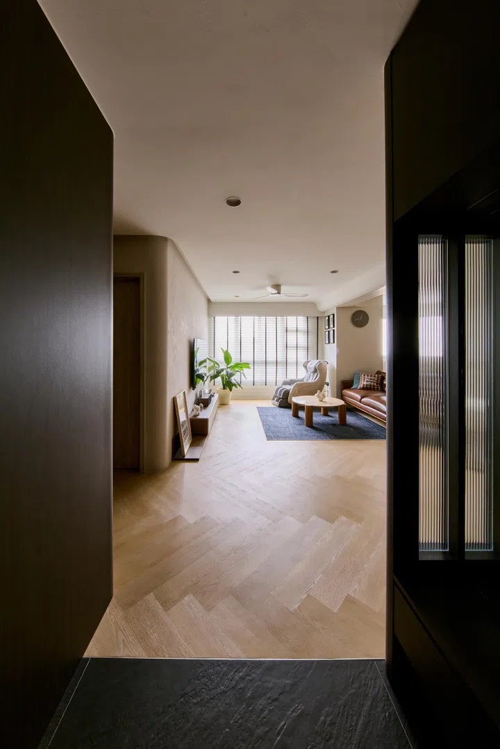 A balance of dark and lighter tones in a 5-room HDB BTO in Woodlands.