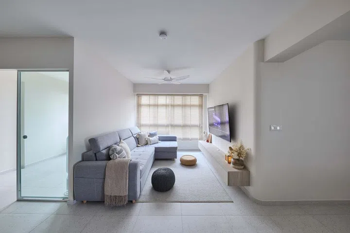 Living room in a minimalist 5-room HDB BTO in Tampines.