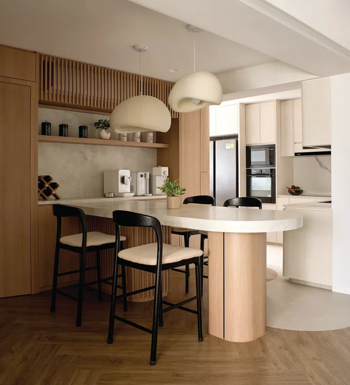 The peninsula dining counter anchors the space with its clean lines and practicality.