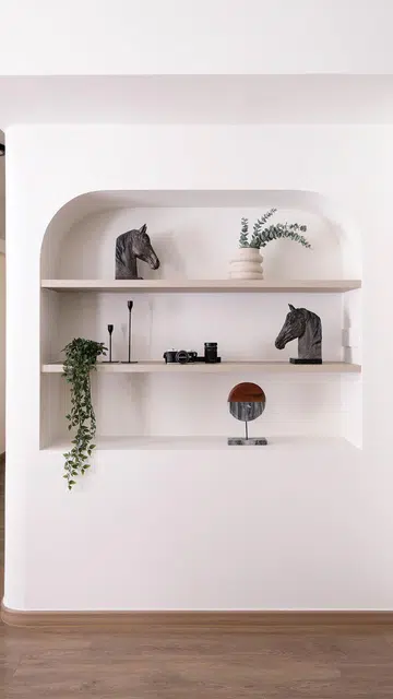 Arch wall niche in the living room of a 3-Gen HDB BTO flat in Tengah Garden.