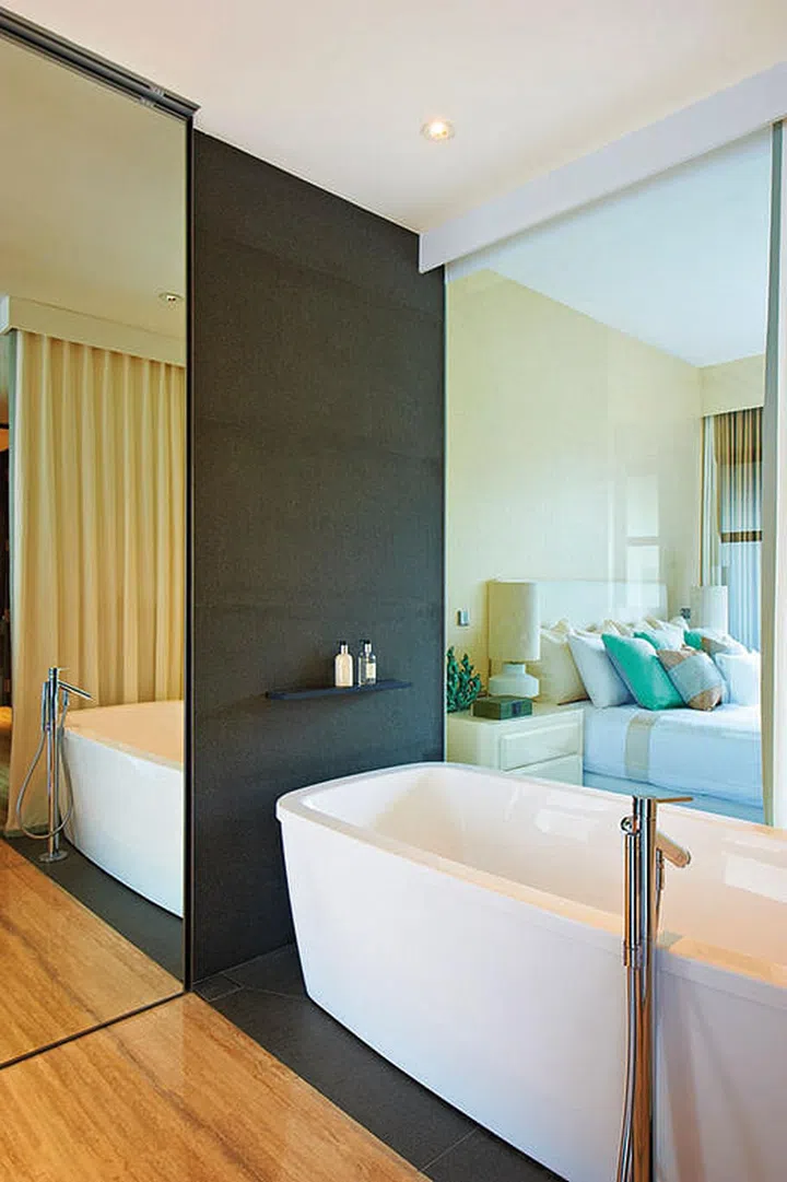 Sumptuous, spa-like facilities such as the bathtub make the master bathroom one of the most luxurious spots in this stylish four-bedroom condominium apartment. Interior Design: Viterbo