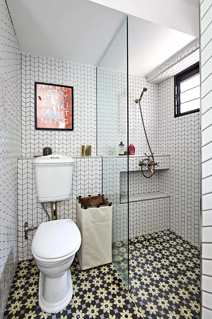 The bright and airy bathroom is the homeowner’s favourite space, who shopped for the antique- style toilets and brass shower fittings at a bathroom warehouse.